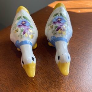 Yellow and White Ceramic Duck Decor with Floral Accents